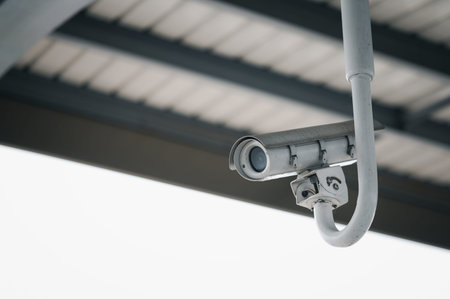 Modern CCTV security system on sky background Smart camera theft protection.