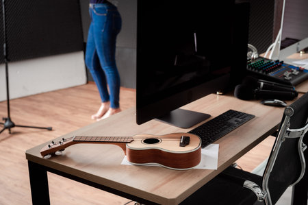 Asian female singer with a passion for music and microphone. While playing her guitar in a...