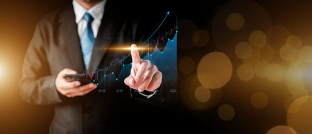 Businessman hand show Stock chart showing rising stock sign with graph indicator. Interest rate...