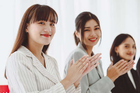 Businessman applauding congratulations with a smiling face during the workshop in the conference room. Brainstorming and teamwork concept.の写真素材