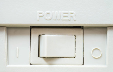 Closeup power button at the photocopier background