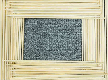 Frame of wood stick on gray carpet texture backgroundの写真素材