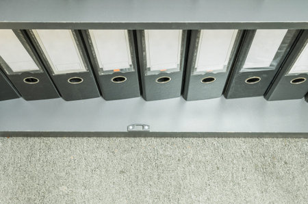 Closeup group of document file in file cabinet on gray carpet background