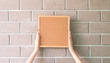 Closeup cork board in hand of woman