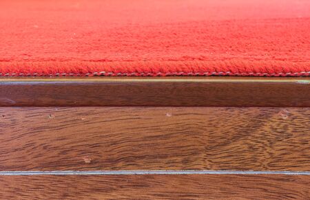 Wood wall with red carpet backgroundの写真素材