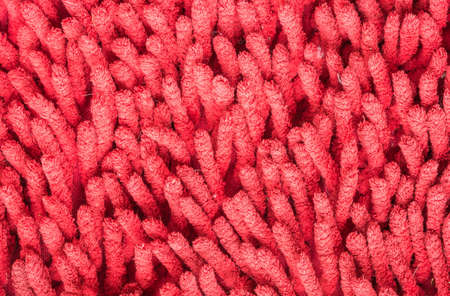 Closeup old and pale red mat texture backgroundの写真素材