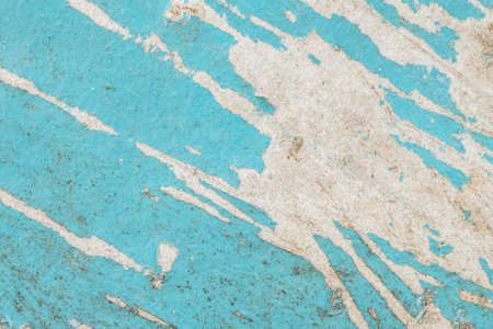 closeup old and peeling blue paint plywood board texture backgroundの写真素材