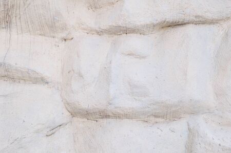 Closeup surface stone pattern at the stone wall in the garden textured backgroundの写真素材