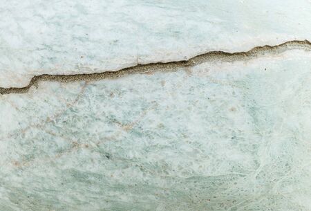 Closeup surface crack marble stone wall texture backgroundの写真素材