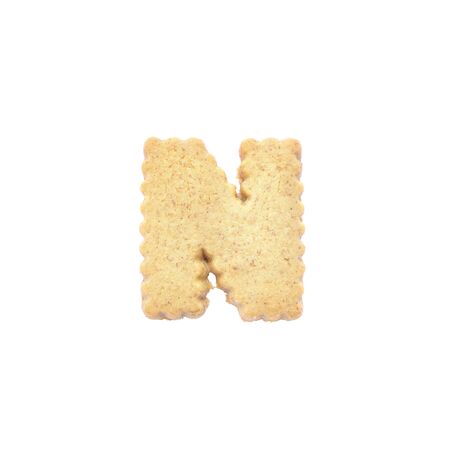 Closeup brown cookie in N english alphabet isolated on white background with clipping pathの写真素材
