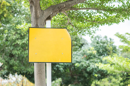 Closeup yellow square label in the public park textured background
