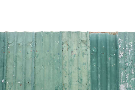 Closeup surface old metal fence at the construction area isolated on white backgroundの写真素材