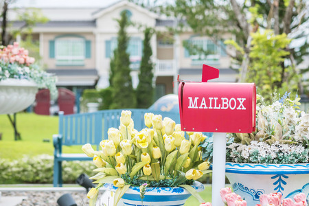 Closeup metal mailbox on garden view textured backgroundの写真素材