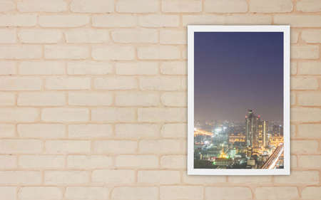 Closeup a window at wall of house with city view at night textured background with copy spaceの写真素材