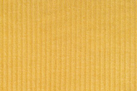 Closeup abstract pattern at yellow women's clothing textured backgroundの写真素材