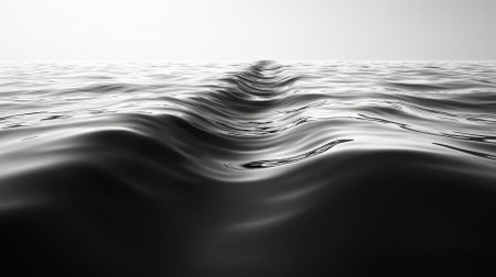 A stunning image showcasing a smooth black water surface with gentle waves, creating a tranquil and serene atmosphere. Ideal for nature and relaxation themes.の素材