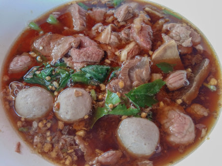 Thai food closeup beef ball and meat soup in white  bowl