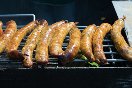 Thai sausage on charcoal stoveの写真素材