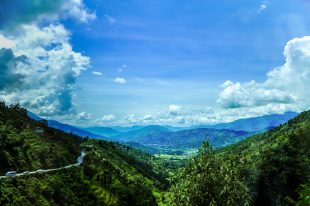 Fields, forests, mountains and blue sky.の写真素材