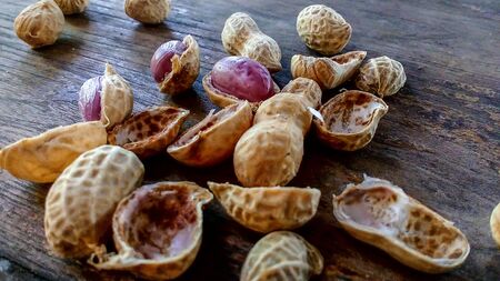 Abstract Still Life picture of a slender boiled sausage stacked on wooden floor.の写真素材