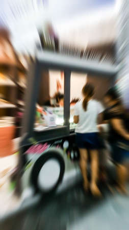 The trade fair, booth selling cheap goods from the manufacturer. A game show and giveaways. Abstract blurの写真素材