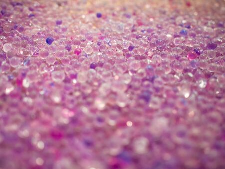 Desiccant or Selica Gel has many colors like glass balls or gems that have bright colors that show moisture. Lay on the floor. Abstract background imageの写真素材