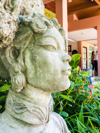 The sculpture carved beautiful women in traditional Chinese dress is ancient in garden. Photos zoom.のeditorial素材