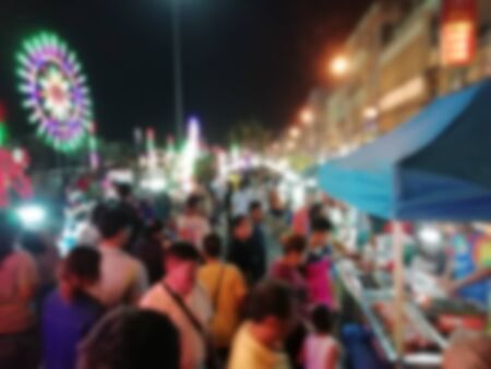 Street food restaurants in the big cities that are housed in these tall buildings That travelers like to seek Delicious food. (Blurred abstract images)の写真素材