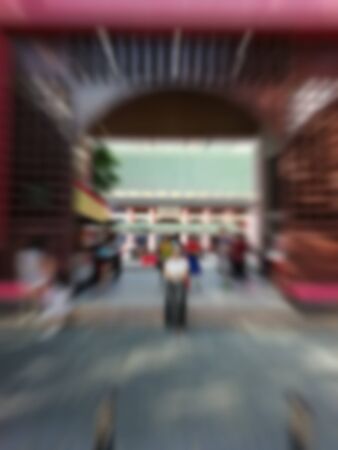 Street food restaurants in the big cities that are housed in these tall buildings That travelers like to seek Delicious food. (Blurred abstract images)の写真素材