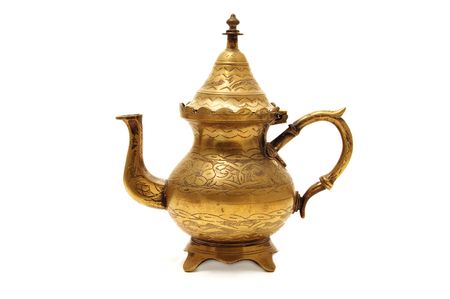 anique golden teapot isolated on a white backgroundの写真素材