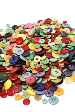 buttons of many colors on a white background