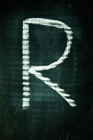 letter written with a chalk on a blackboard