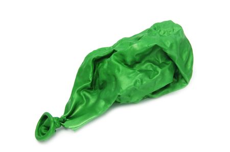 green deflated balloon isolated on a white backgroundの写真素材