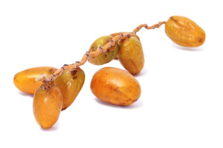 a pile of dates isolated on a white backgroundの写真素材