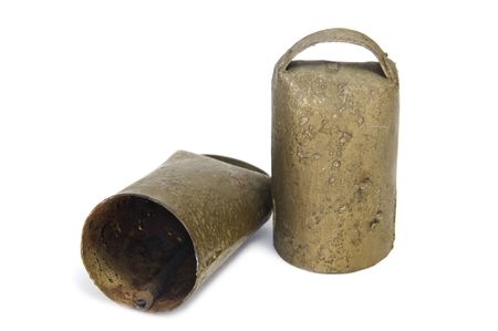 an old cowbell isolated on a white backgroundの写真素材