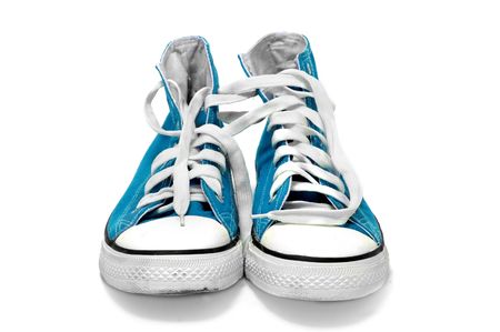 a pair of blue sneakers isolated on a white backgroundの写真素材