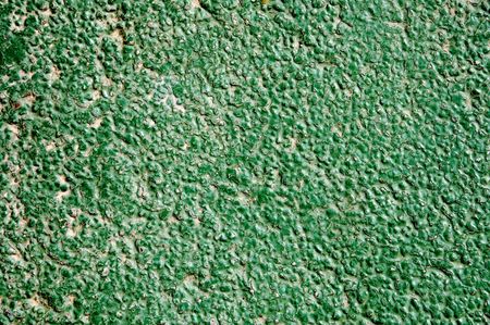 background made of a close-up of a green wallの写真素材
