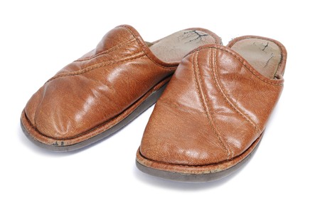 a pair of brown slippers for man isolated on a white backgroundの写真素材