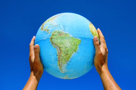 someone holding a globe in his hands