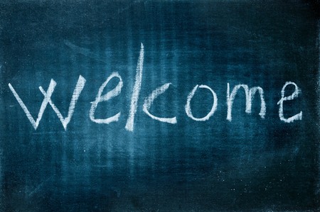 welcome written with a chalk on a blackboardの写真素材