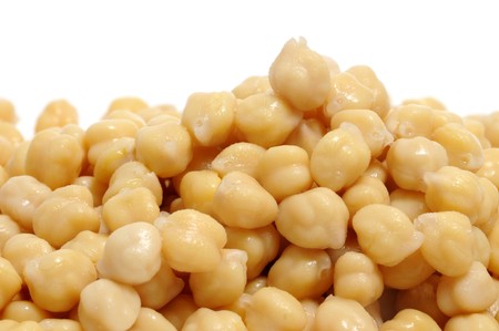 closeup of a a pile of chickpeas on a white bacgroundの写真素材
