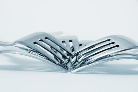 a pile of forks on a degraded background