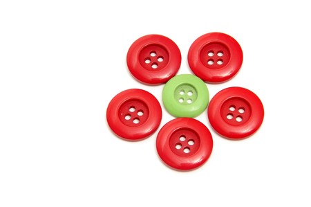 a flower made with buttons isolated on a white backgroundの写真素材