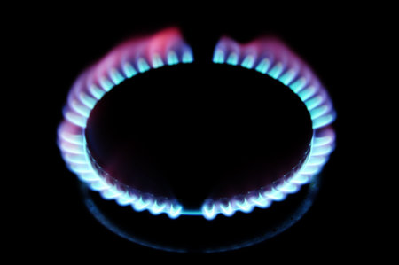 igniting a gas stove on a black background