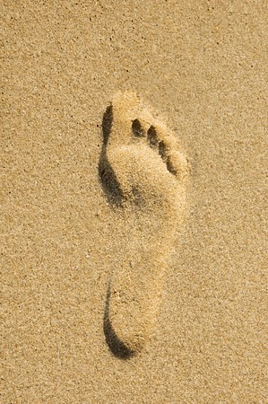 A footprint in the sand on a beachの写真素材