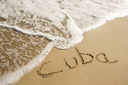 cuba written on the sand of a beachの写真素材
