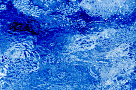background made of a close-up of water waves