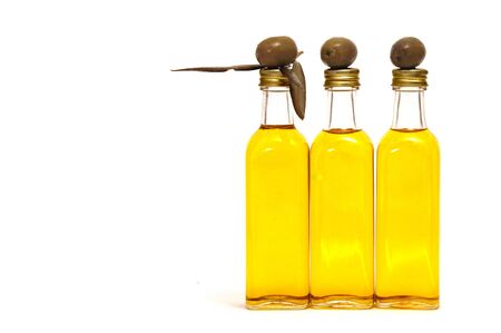 some bottles of olive oil isolated on a white backgroundの写真素材