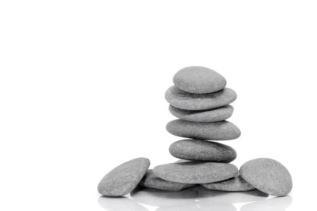 a pile of zen stones on a white backgroundの写真素材