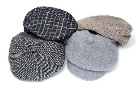 some flat caps and bonnets isolated on a white background